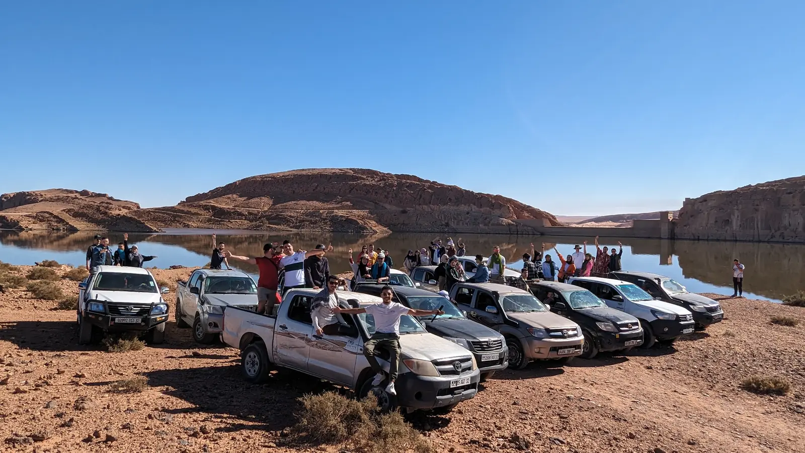 The Tourago 4x4 convoy lined up on the desert plain at El Bayadh