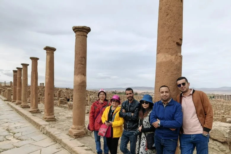 A Tourago group among the columns of the main street at Roman Timgad